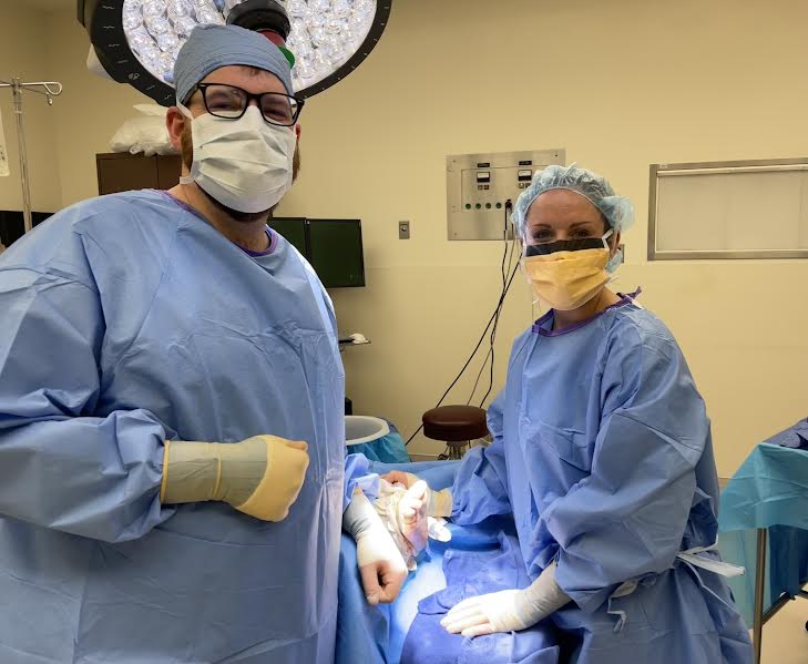 doctors in operating room performing surgery